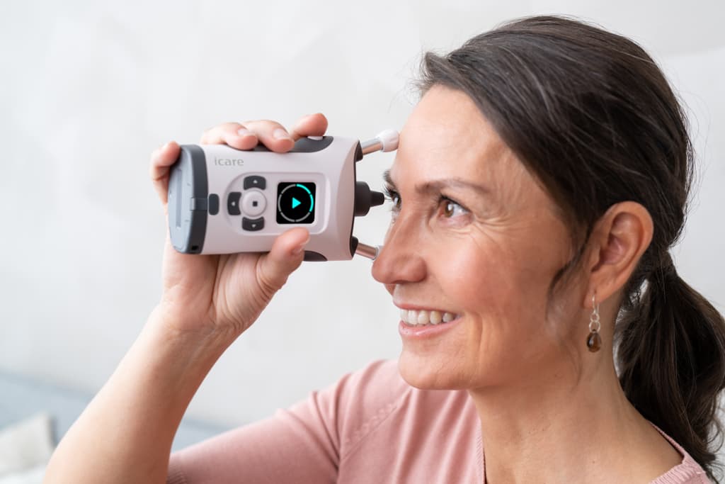 Patient using the iCare HOME2 tonometer at home